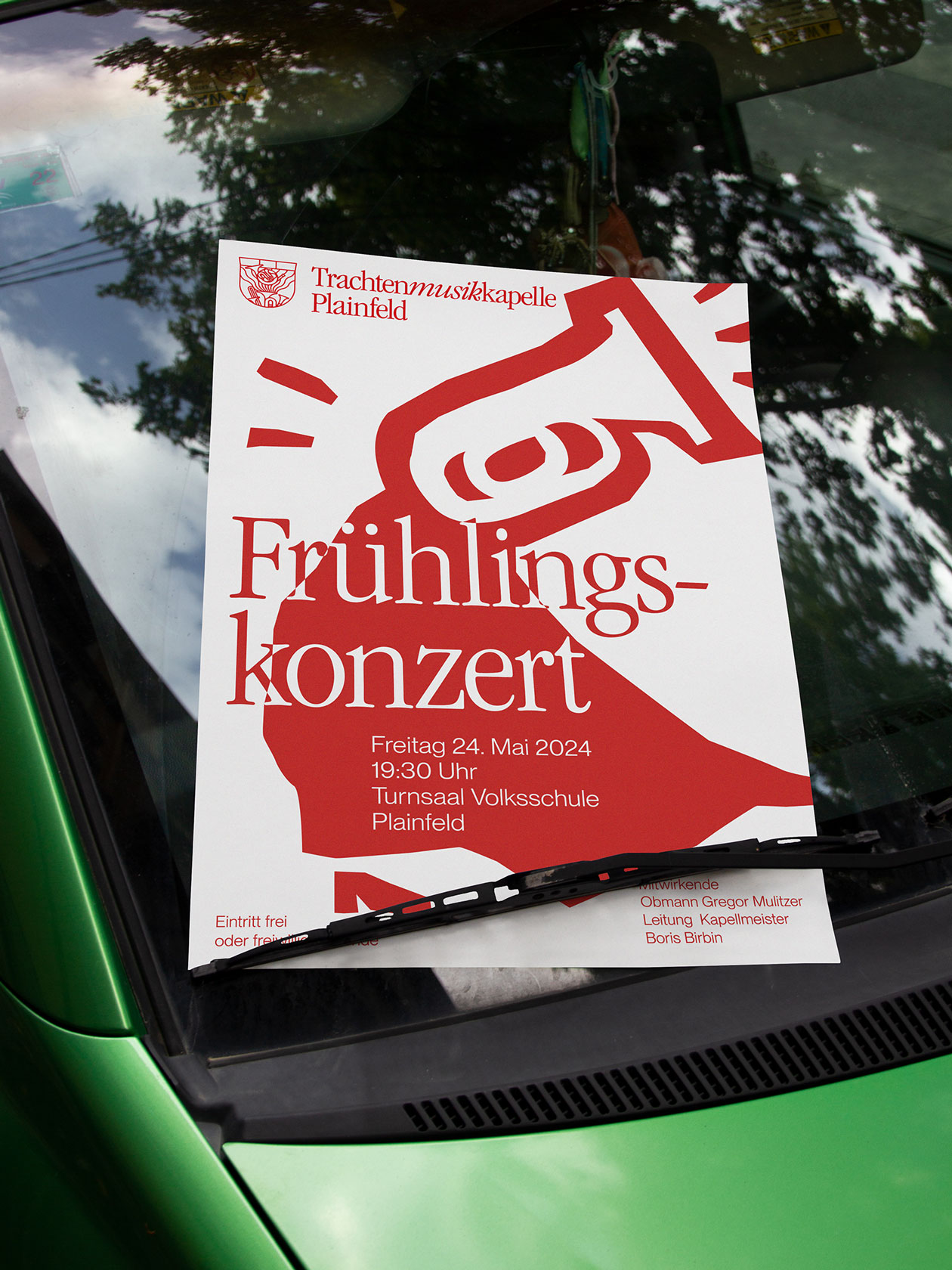 Spring concert poster with a red instrument character on a windscreen
