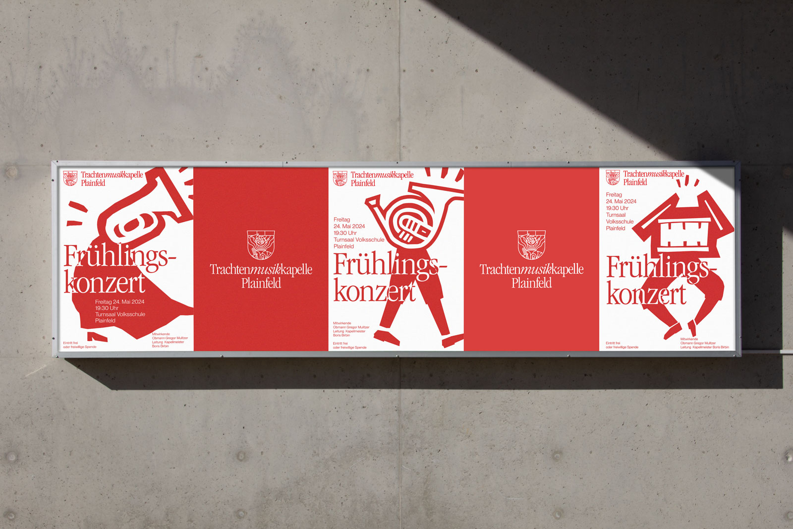 Row of red-and-white spring concert posters on a concrete wall