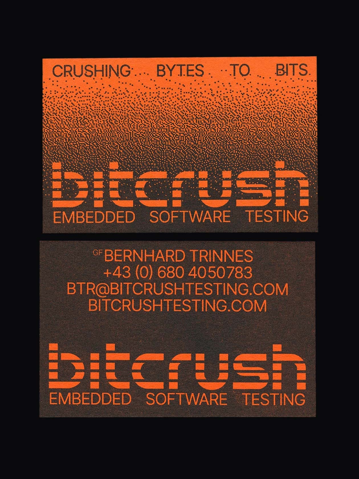 Orange-and-black bitcrush business cards with a pixelated wordmark
