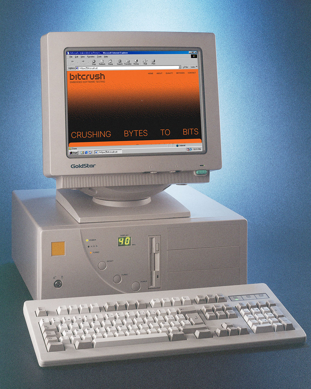 Desktop computer displaying the bitcrush website with a keyboard