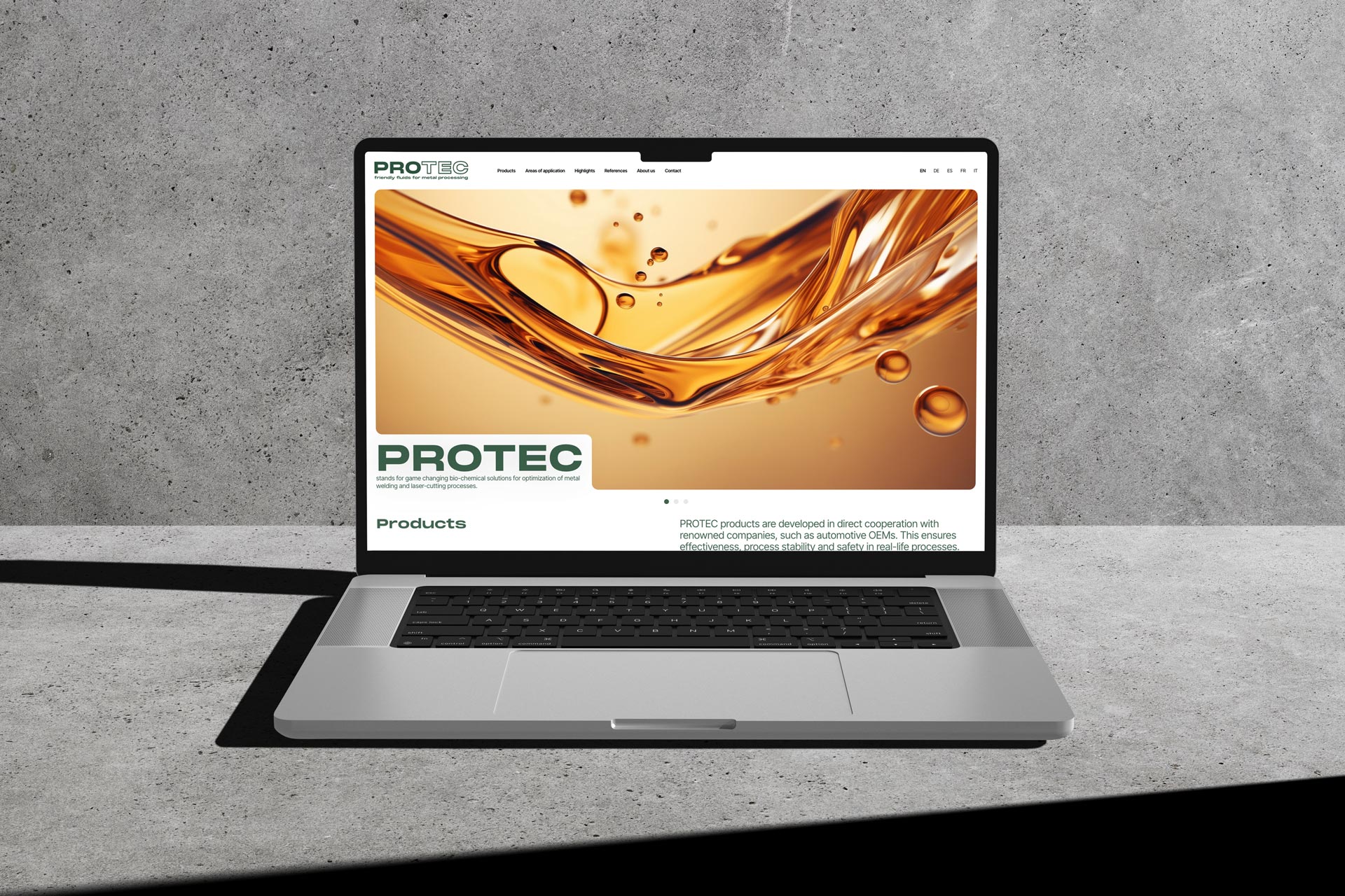 PROTEC website with a golden liquid visual on a laptop