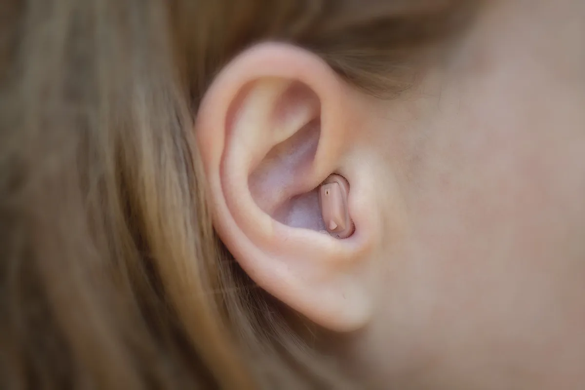 Person listening clearly thanks to hearing care
