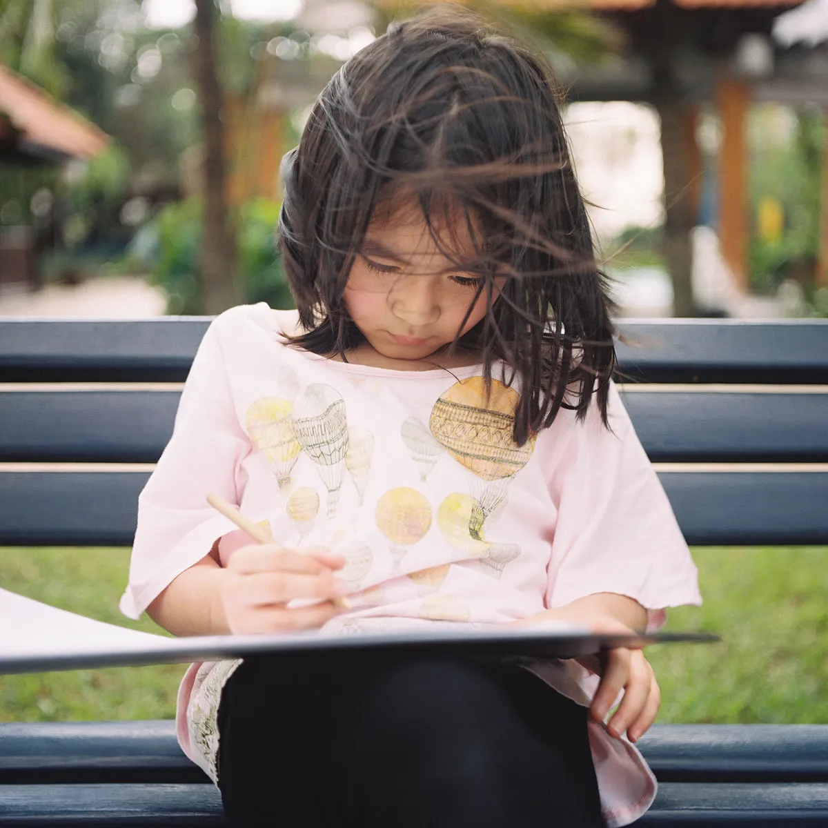 Person reading a book in the park
