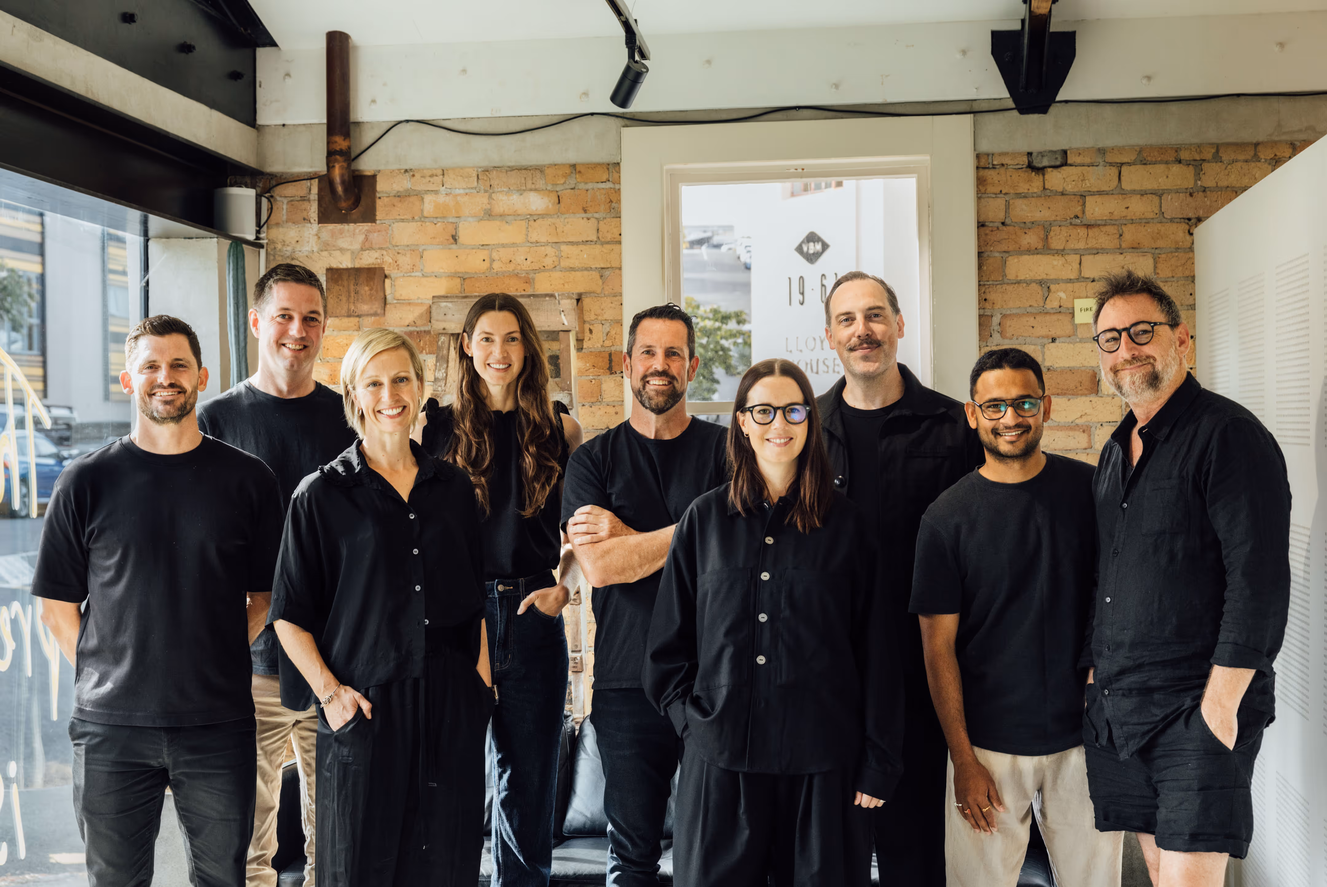 A professional photo of the team at New+Improved