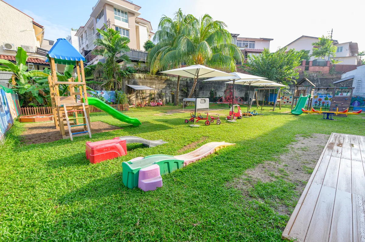 Outdoor garden and play area at Les Petits Gaulois