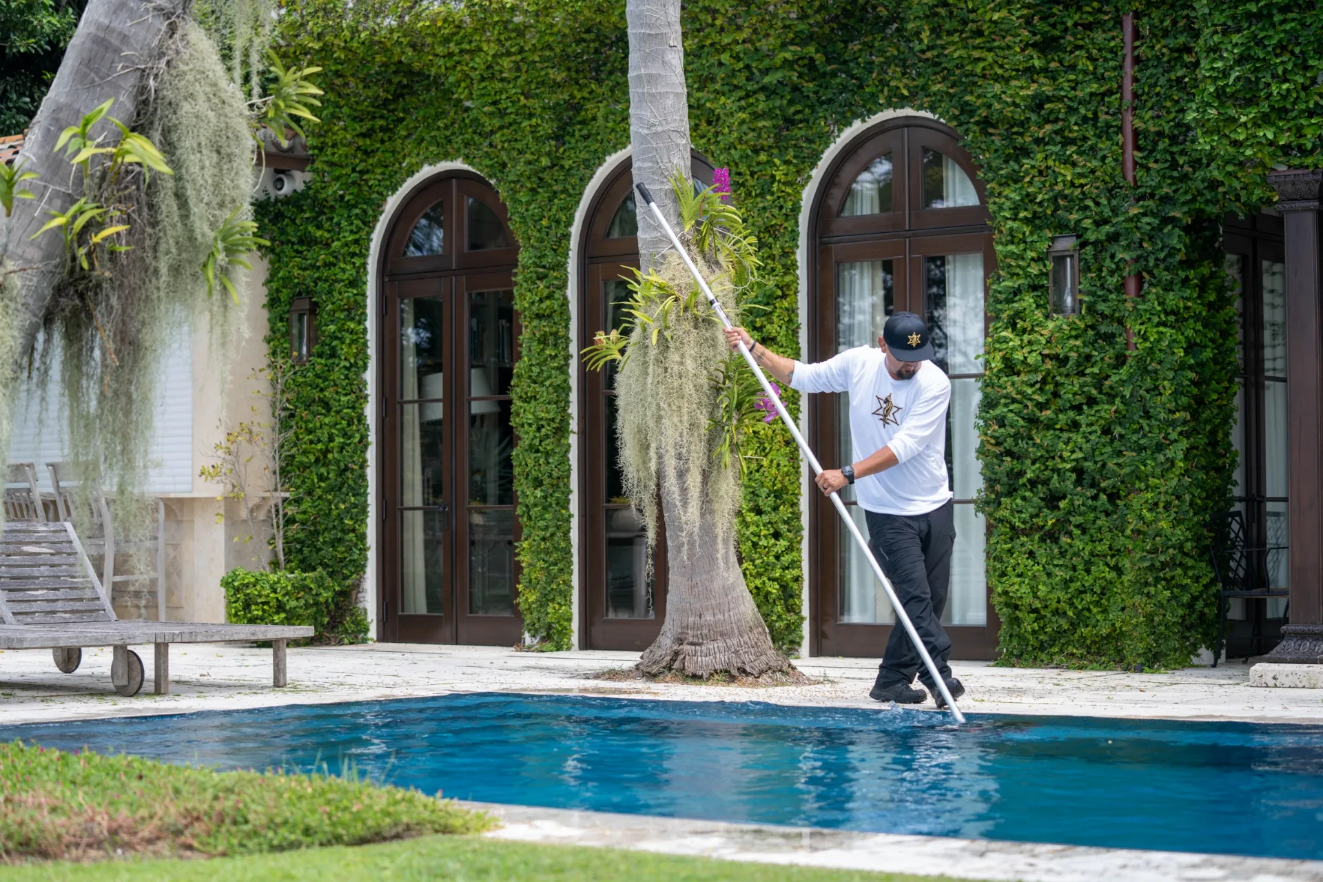 Pool Rangers technician servicing a Miami pool