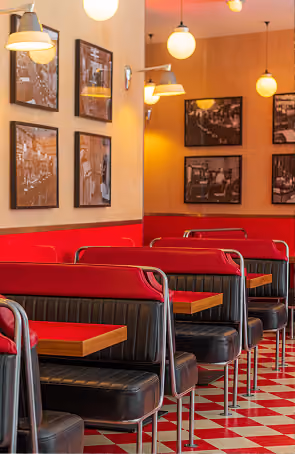 Wowburger's retro diner-style booth seating with red and white checkered accents
