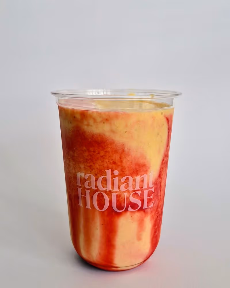 Yellow and red swirled smoothie