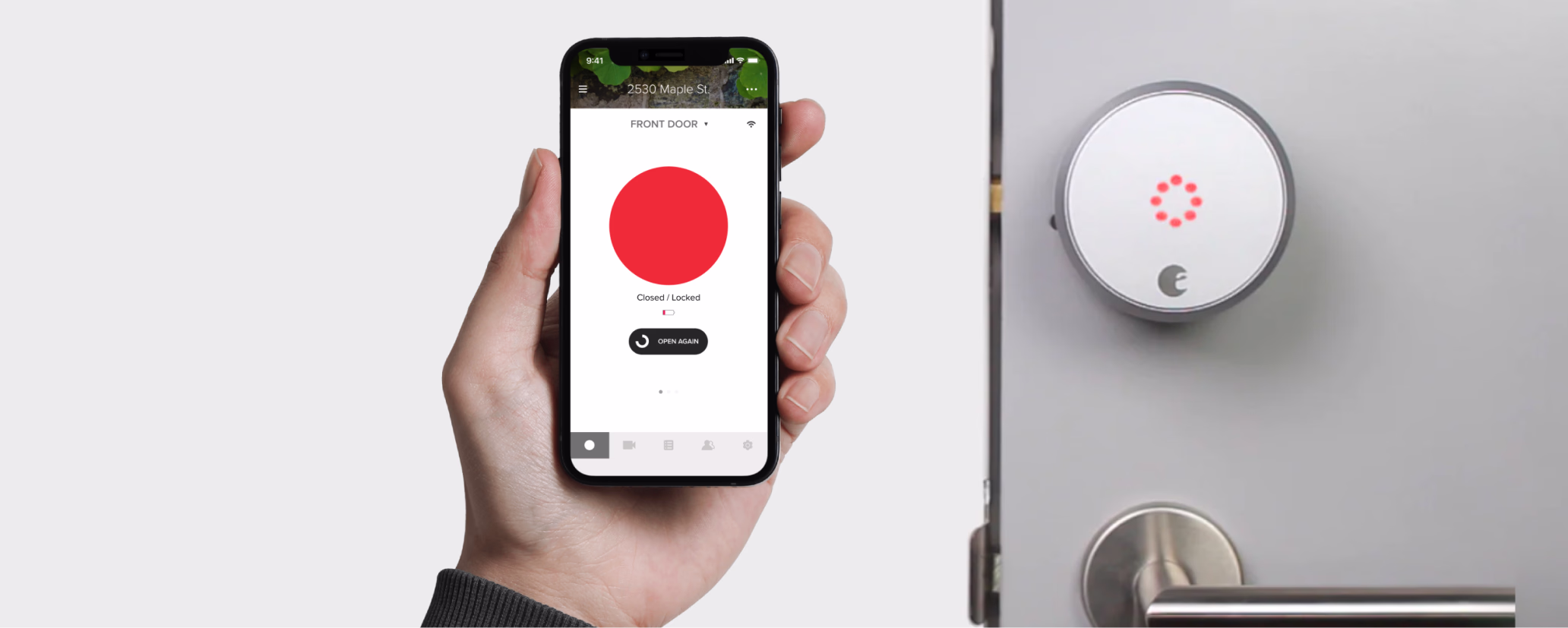 Hand holding a phone showing the locked status in the August app next to an August smart lock.
