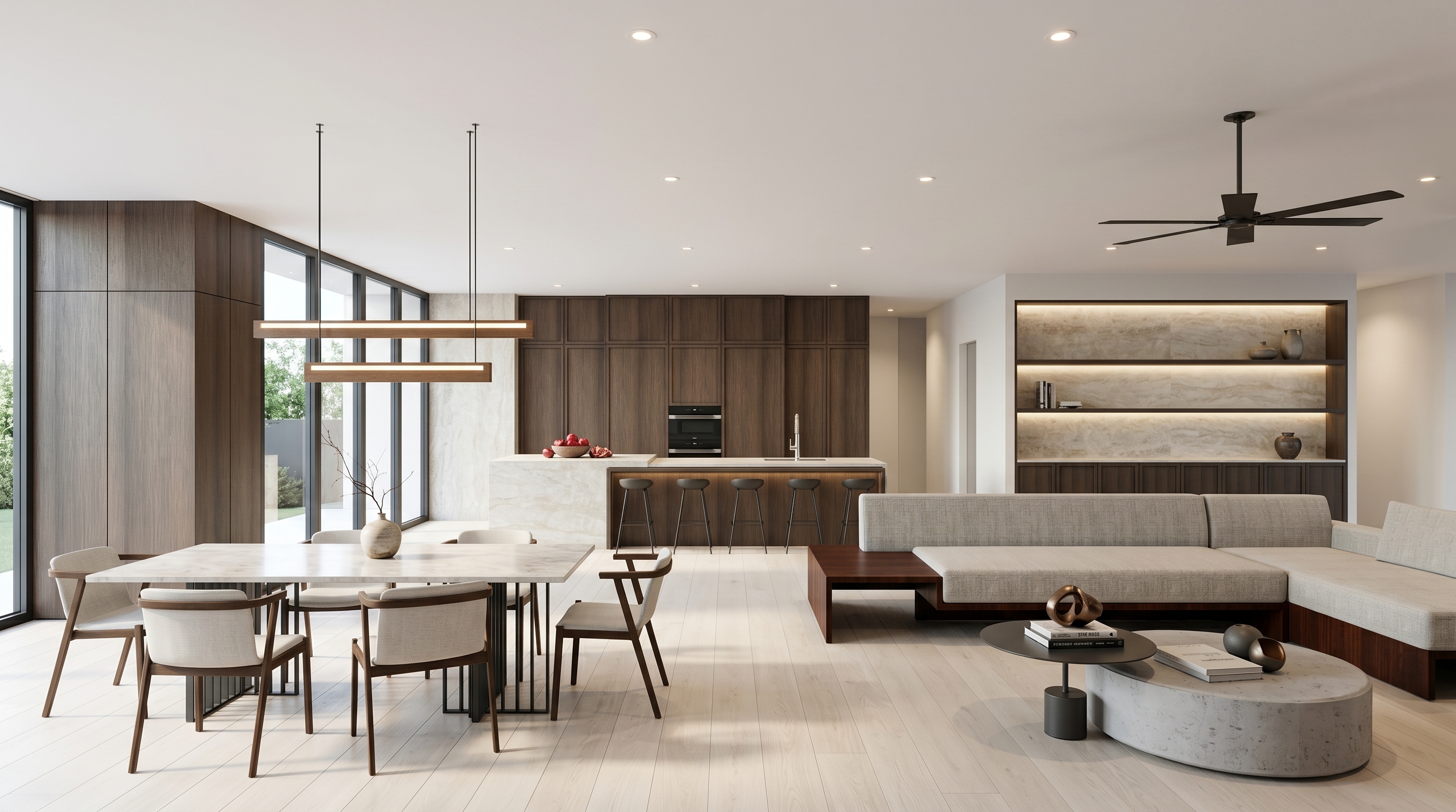 A walnut and marble kitchen with a sculptural island, dark concrete floor, and integrated tall storage.
