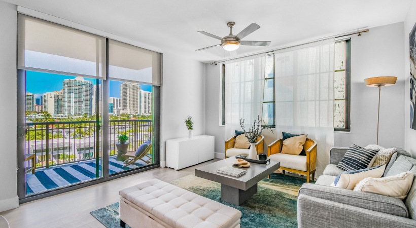 Living Room with couch and chairs and view to balcony