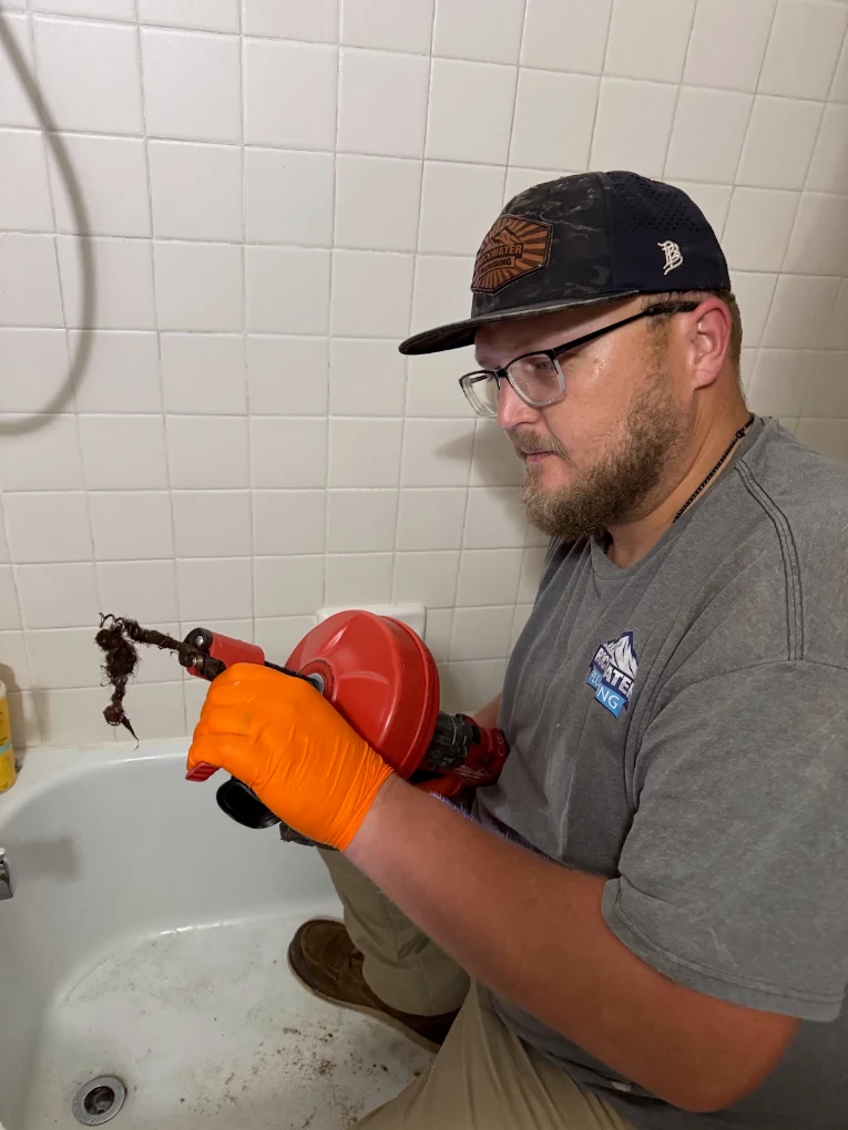plumber repairing a drain