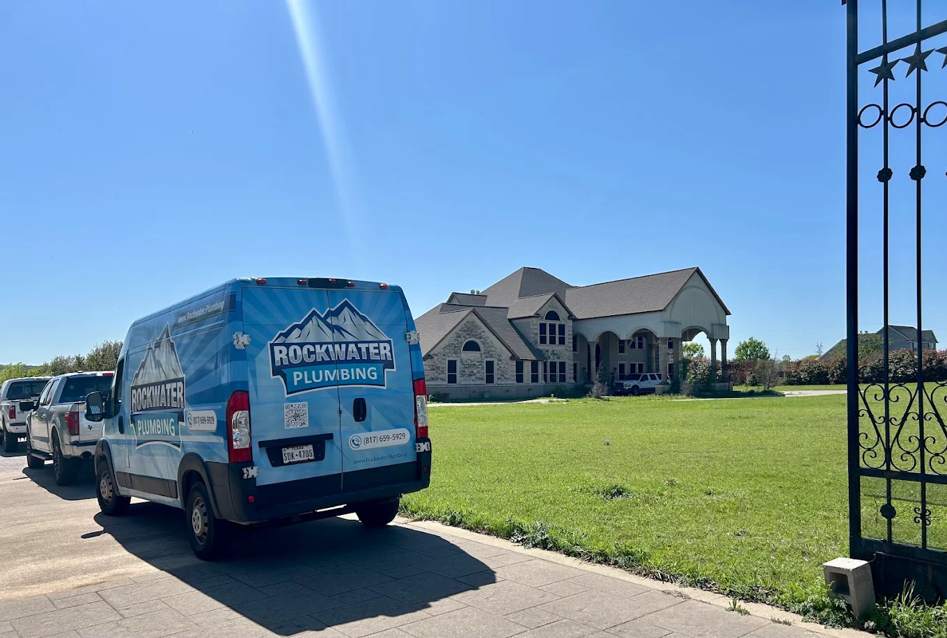 plumbers at a house for water softener services