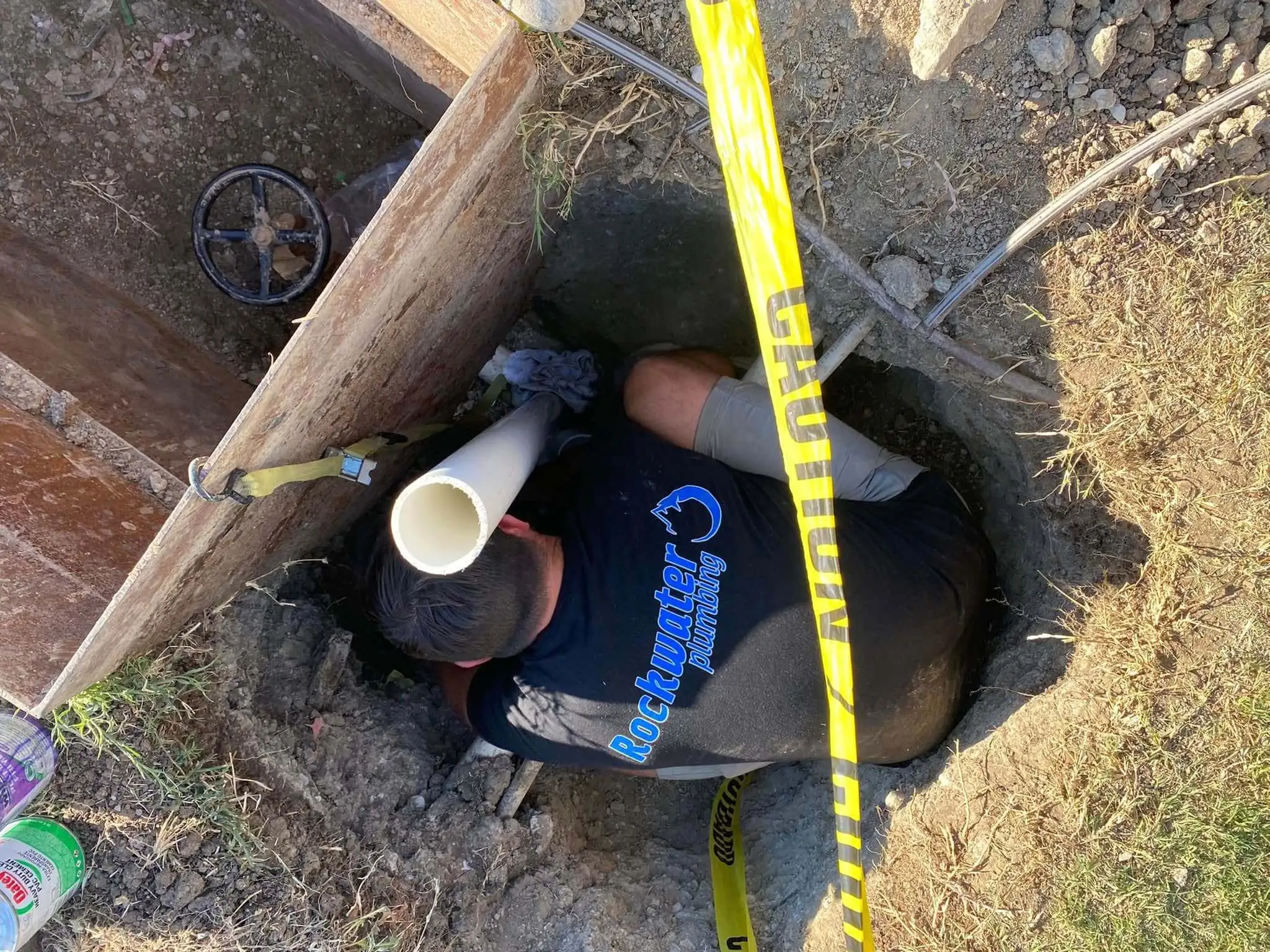 plumber repairing a sewer line