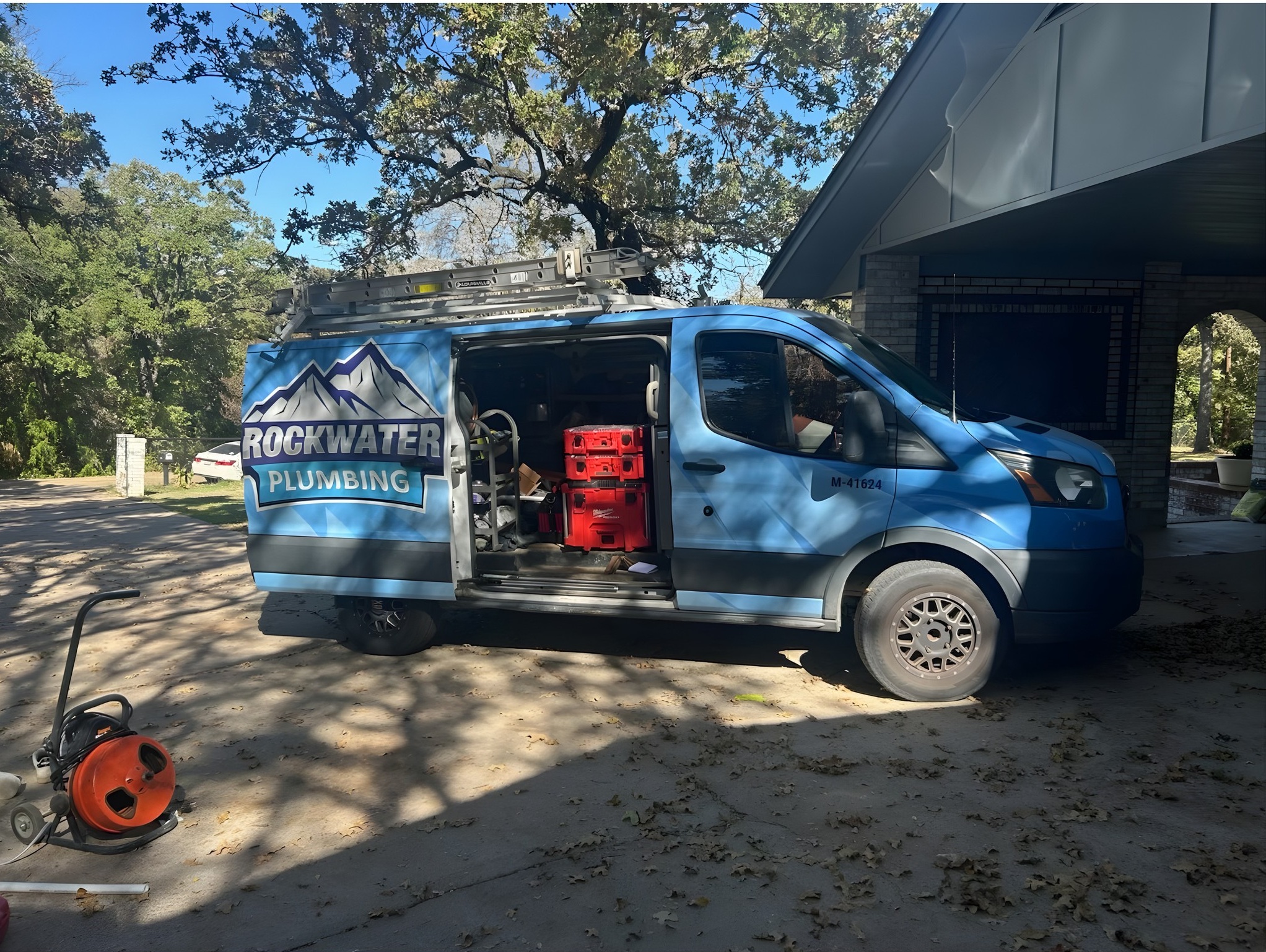 plumbing van with drain repair tools