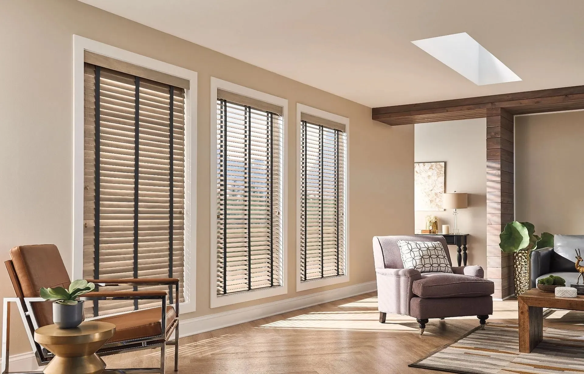 Two-tone wood blinds with cloth tapes on tall living room windows