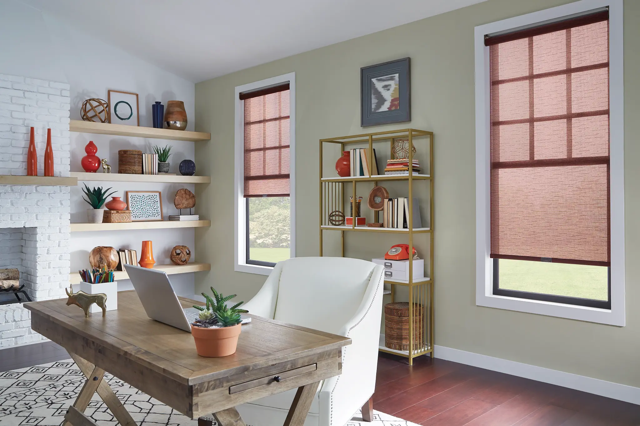 Rust-colored solar shades on windows in a home office