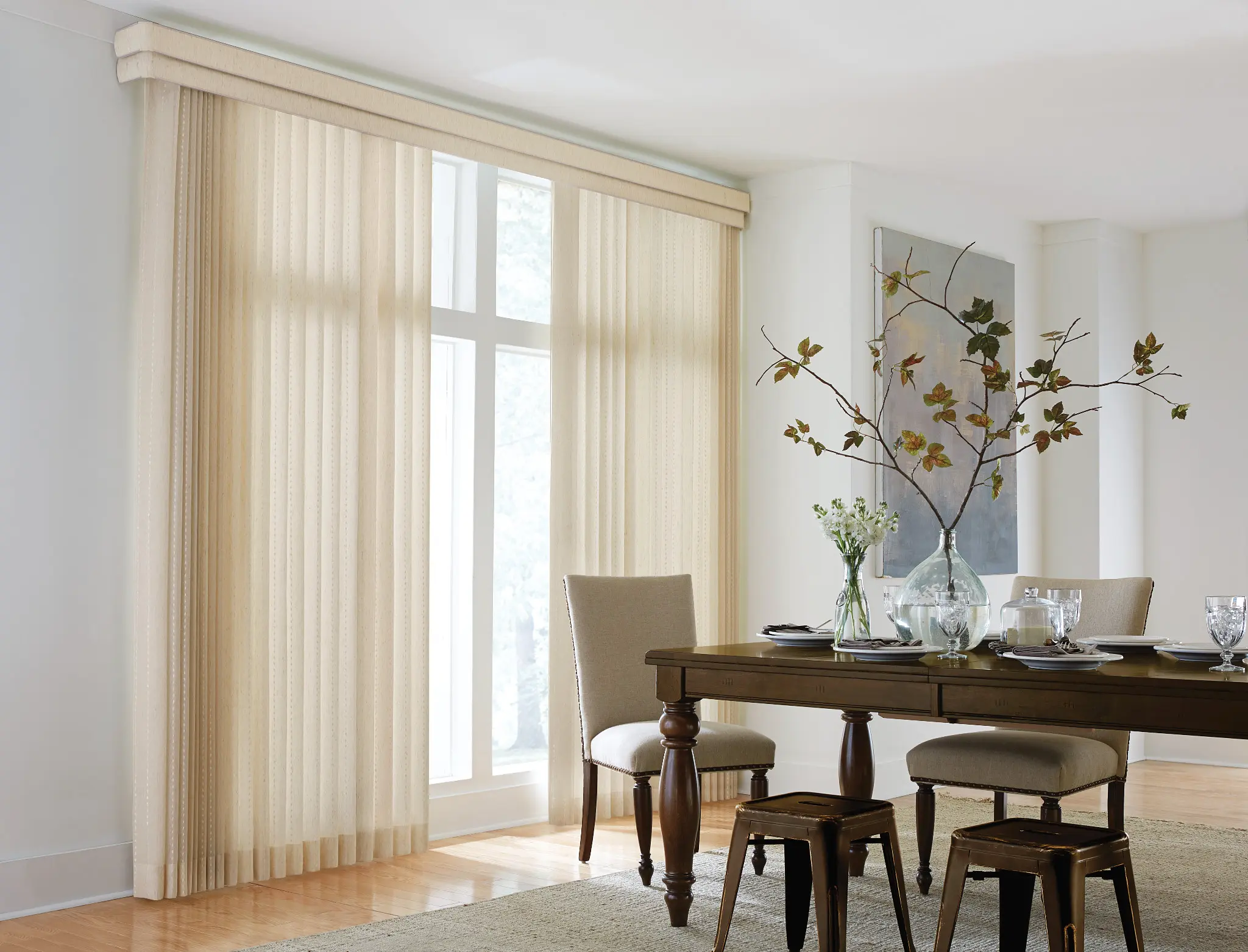 Sheer fabric vertical blinds on a sliding glass door in a dining room