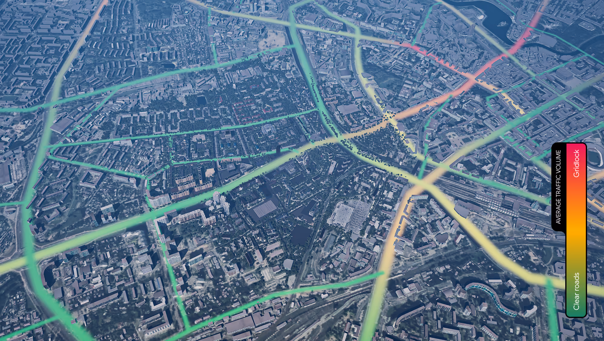 Aerial city map with highlighted roads showing average traffic volume from clear (green) to gridlock (red) using a color gradient scale.