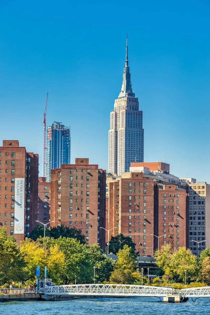 Empire State Building with nearby brick apartments