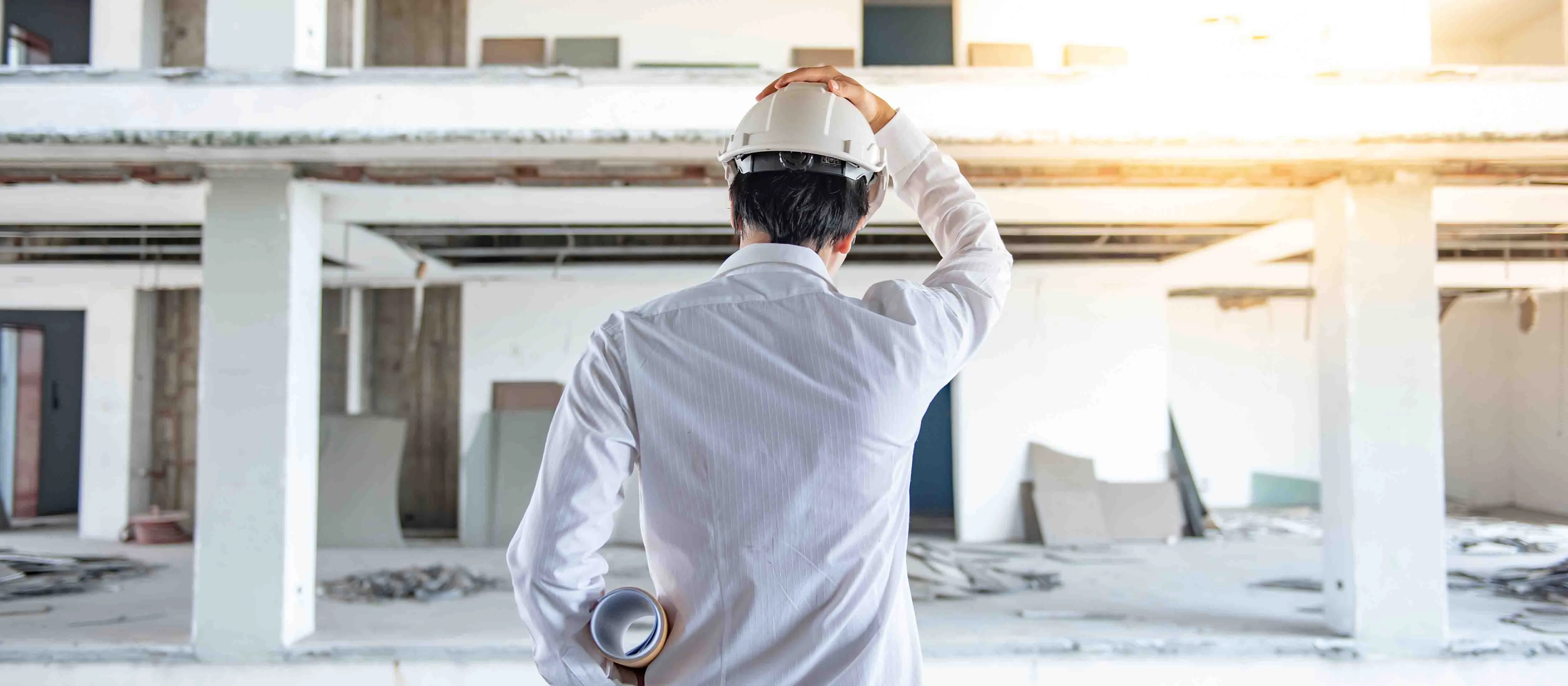 Technician reviewing a commercial building during installation planning