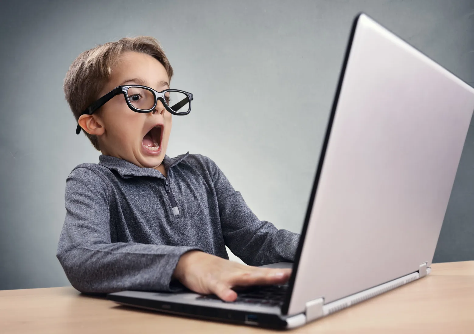 Child using a laptop to access the internet