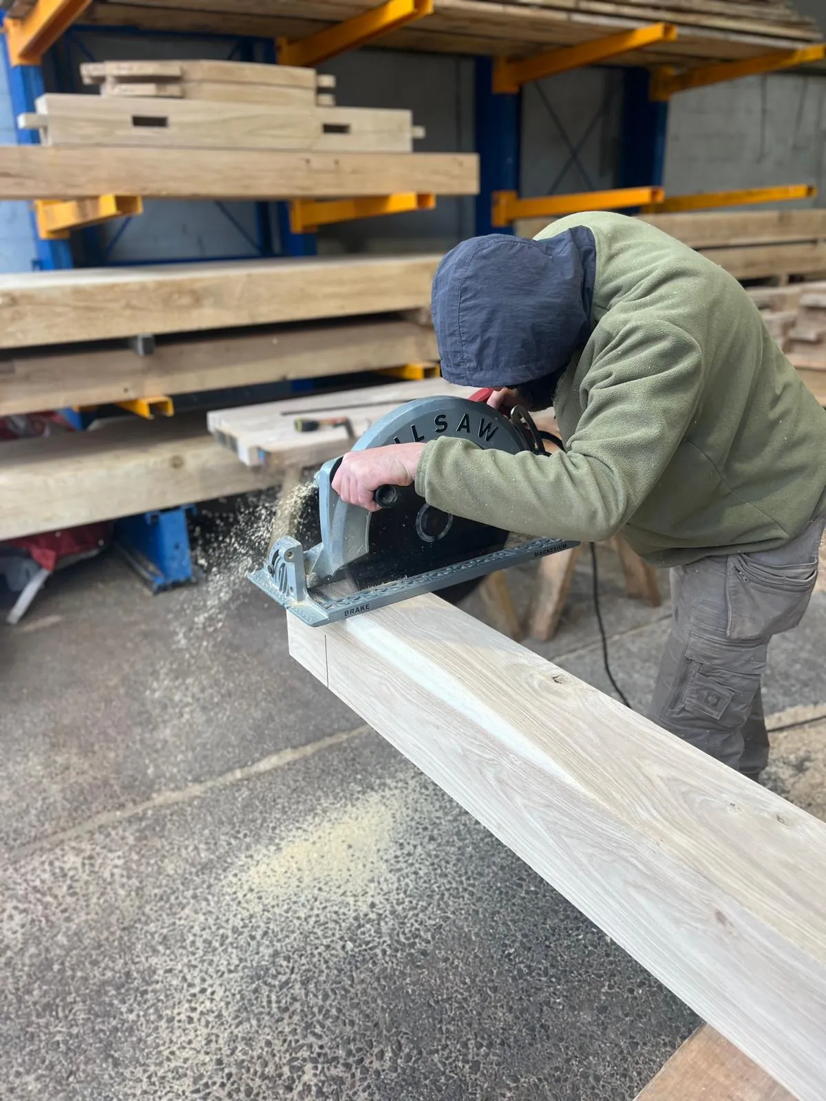 Cutting an oak beam in the workshop