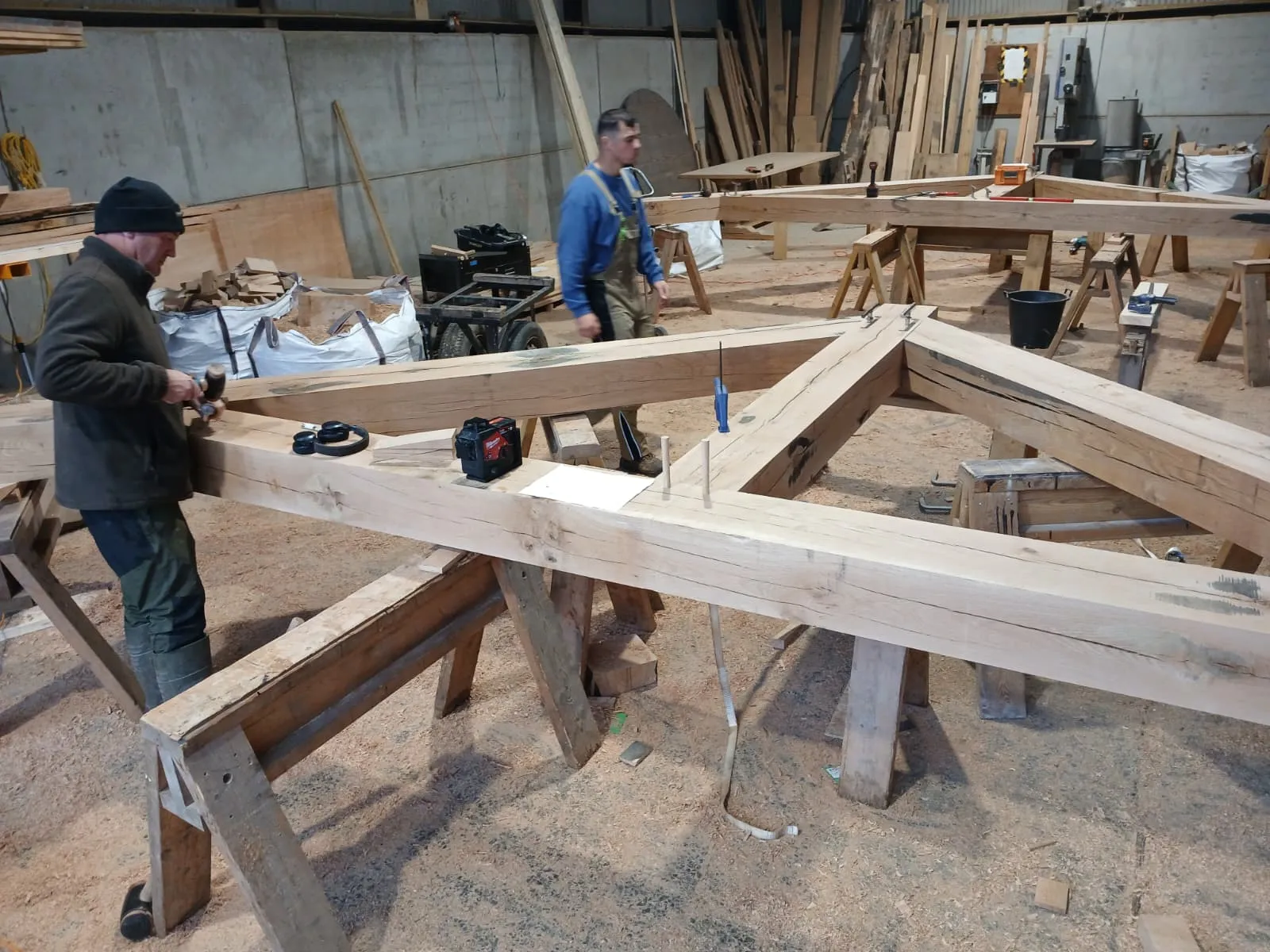 A truss laid out on trestles in the workshop