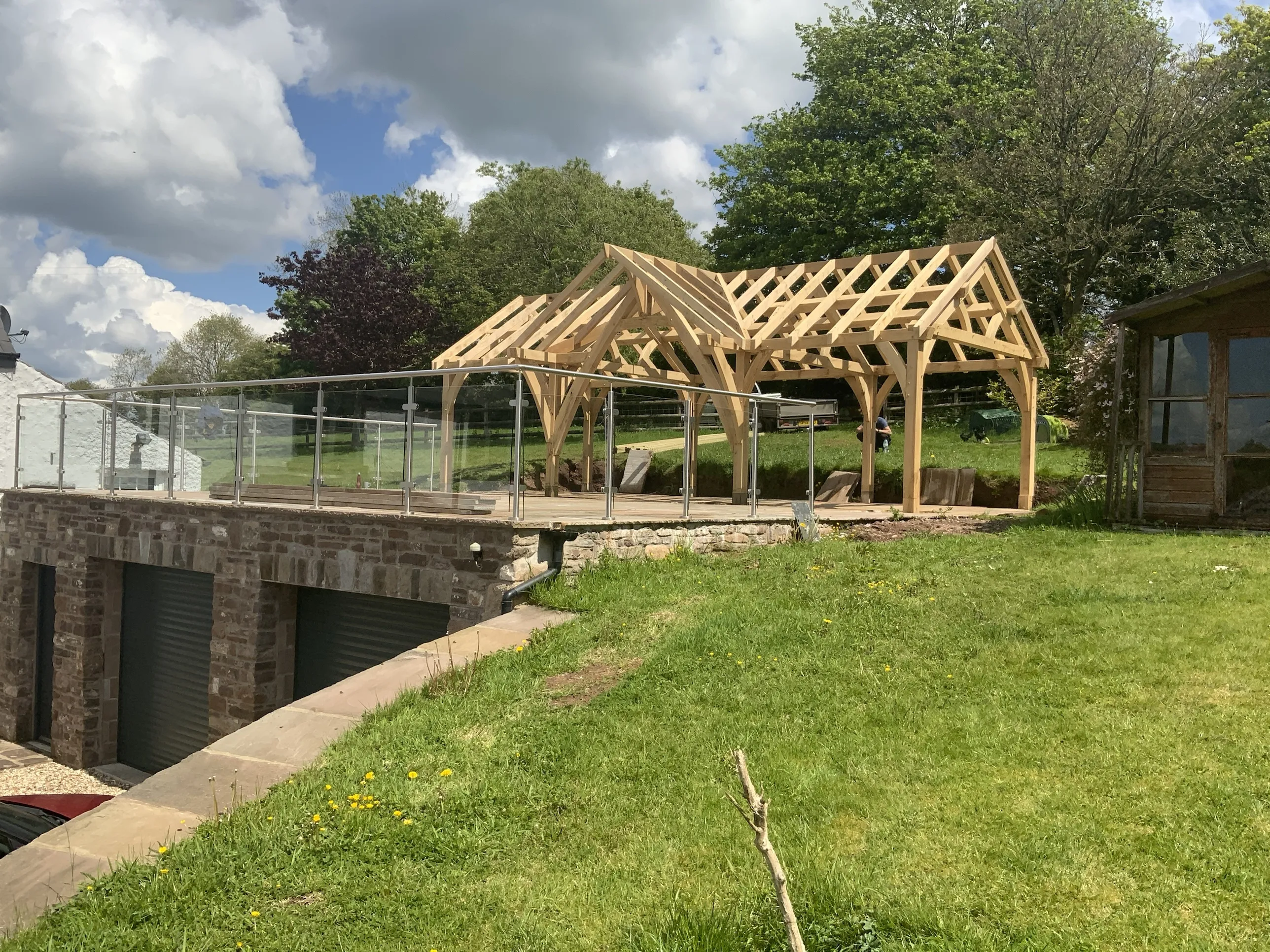 An oak frame newly raised on a terrace at Devauden