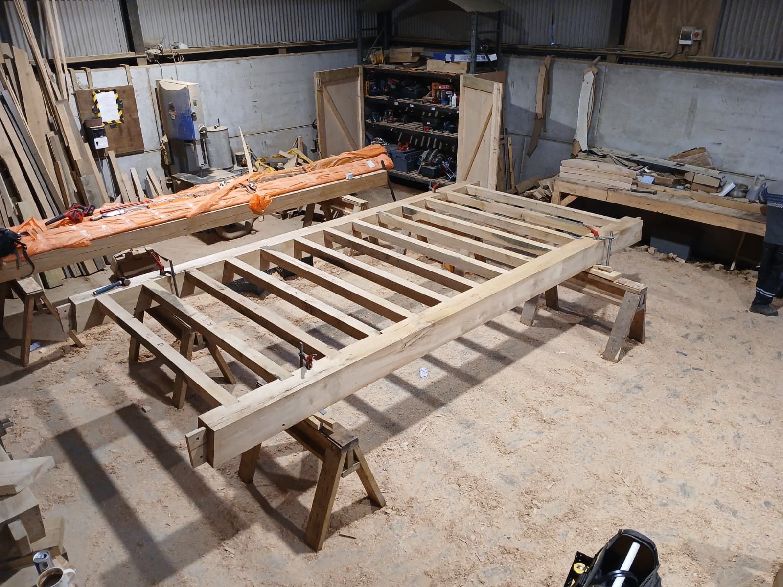 An oak balcony frame assembled on trestles in the Foxtail Oak workshop.