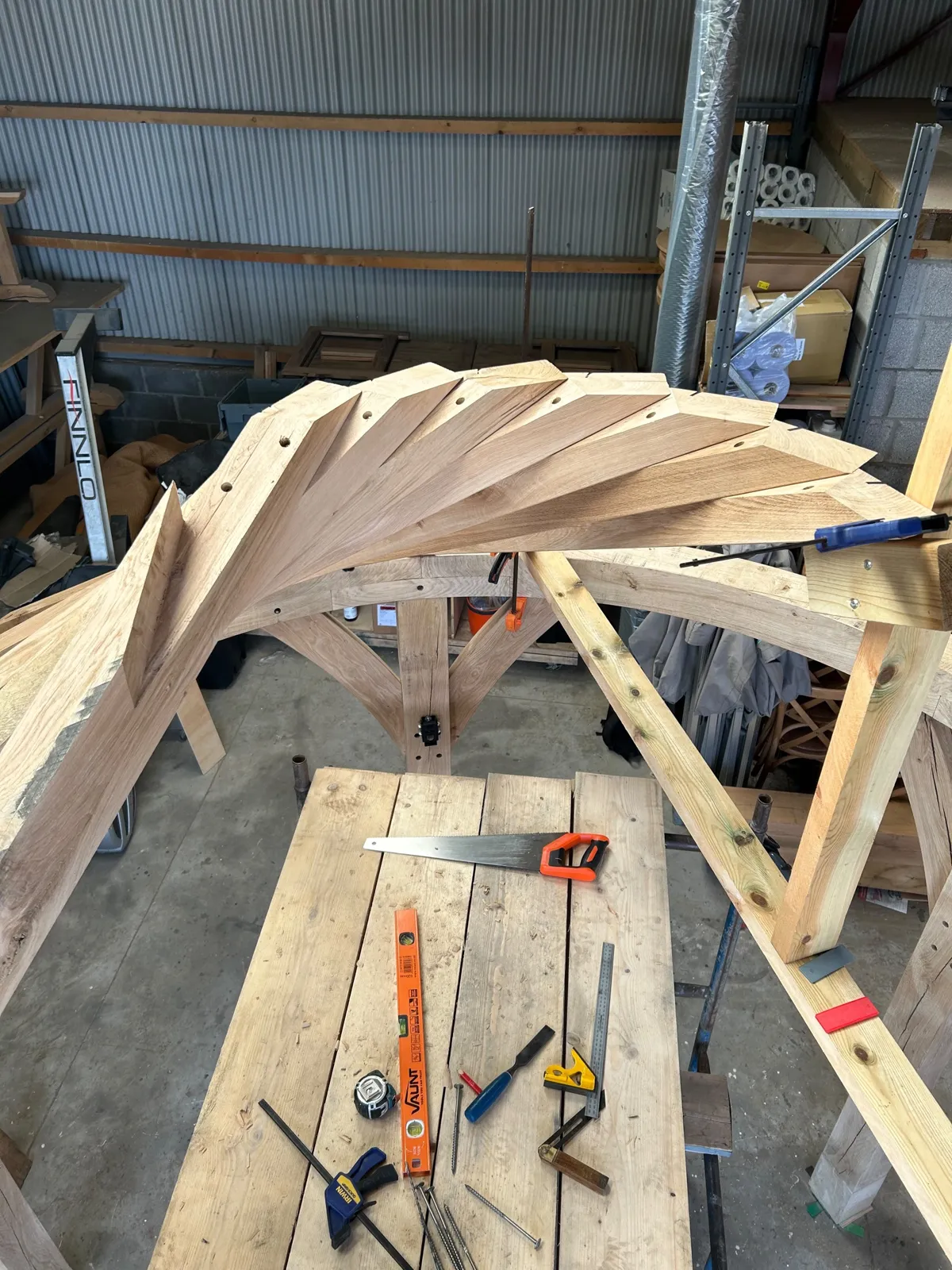 Curved oak rafters of the Worl dry-fitted in the workshop