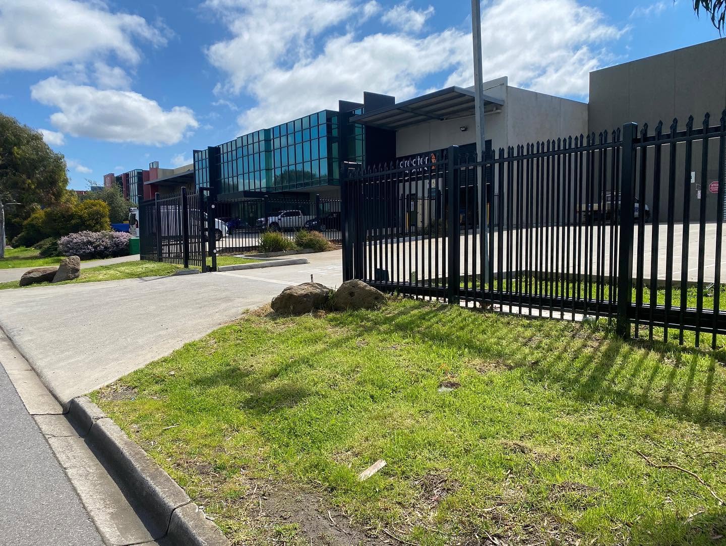 GSP Engineering black spear-top security fencing and cantilever gate at Hudson Pacific commercial site