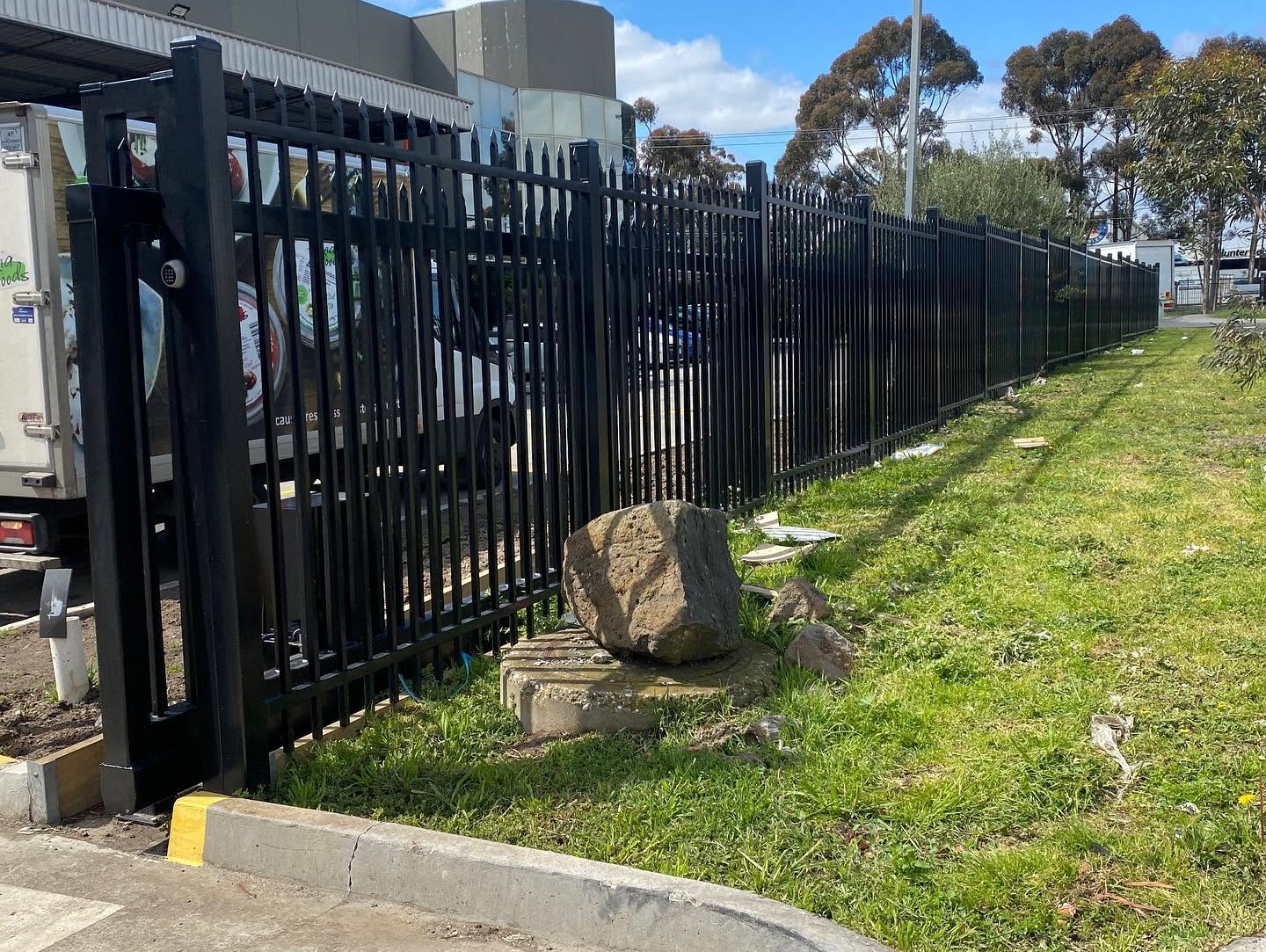 Commercial perimeter-fence panels with coordinated cantilever-gate post interface