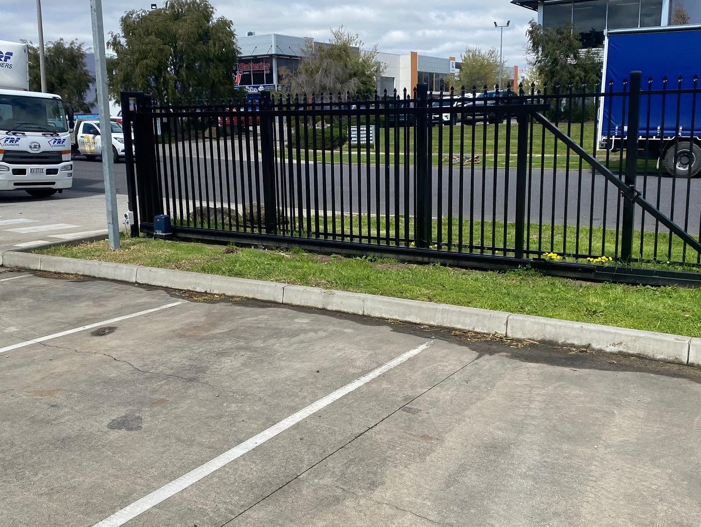 Black spear-top security fencing and cantilever gate at Hudson Pacific commercial site