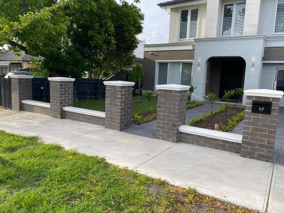 Grey brick boundary piers at Pascoe Vale home before installation of classic spear steel fencing