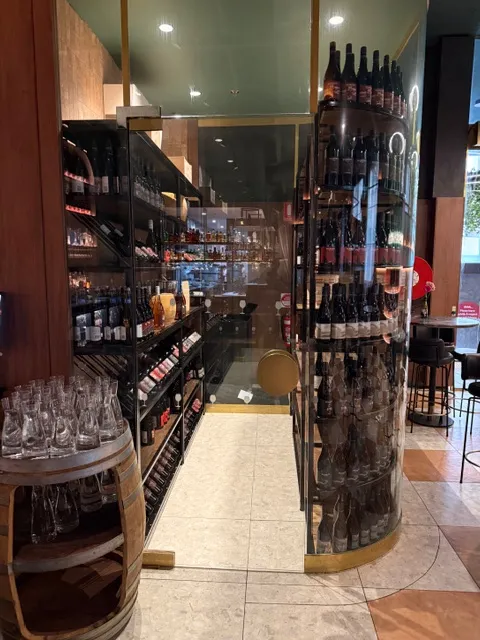 Clear circulation aisle between custom wine-racking displays