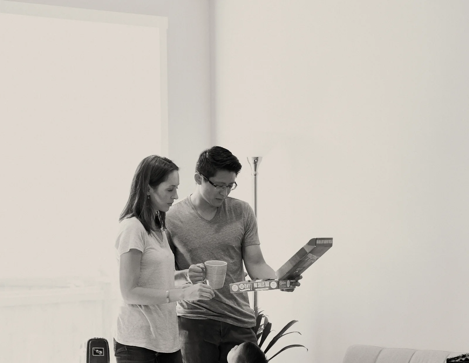 A couple unpacking in their first home