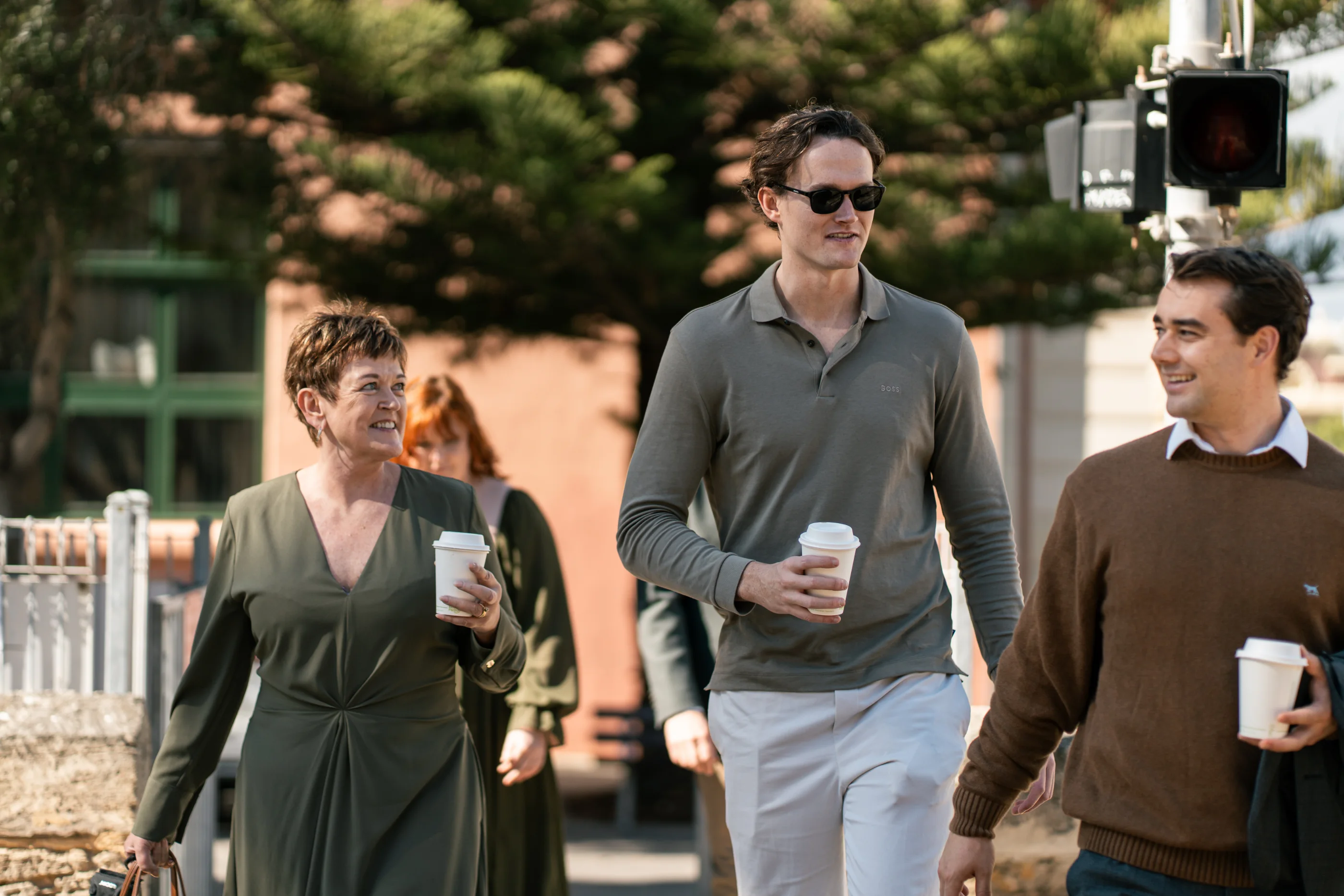 Clients walking together on a suburban street