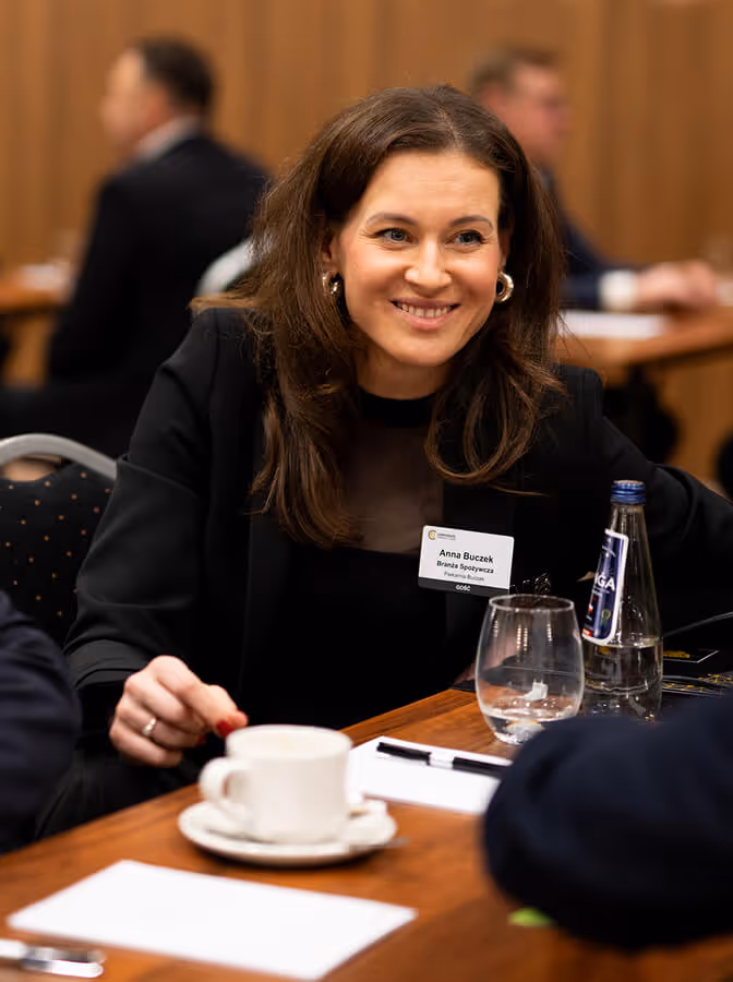 A member wearing her name badge at a CC US chapter meeting