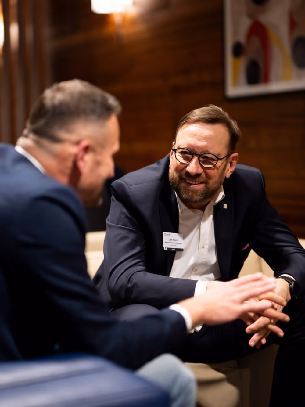 Two members in conversation at a CC US chapter event