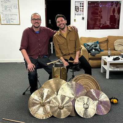 Dave Collingwood and Spanish cymbalsmith Pablo Nadal Rocamora in front of the cymbals Dave taught Pablo to make