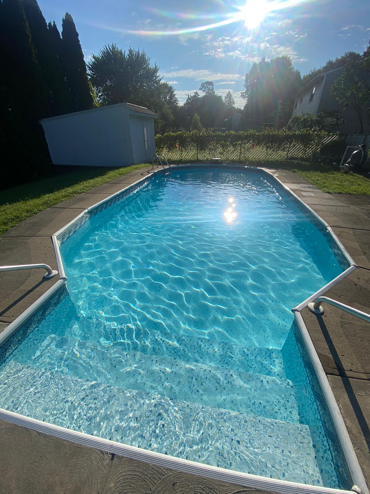 Sparkling backyard pool maintained by Queen City Pools
