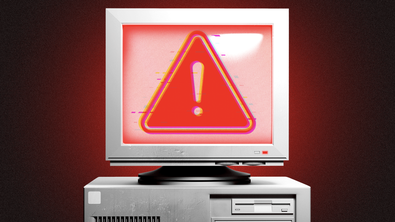 Glitching warning sign on a computer screen, representing a cybersecurity alert