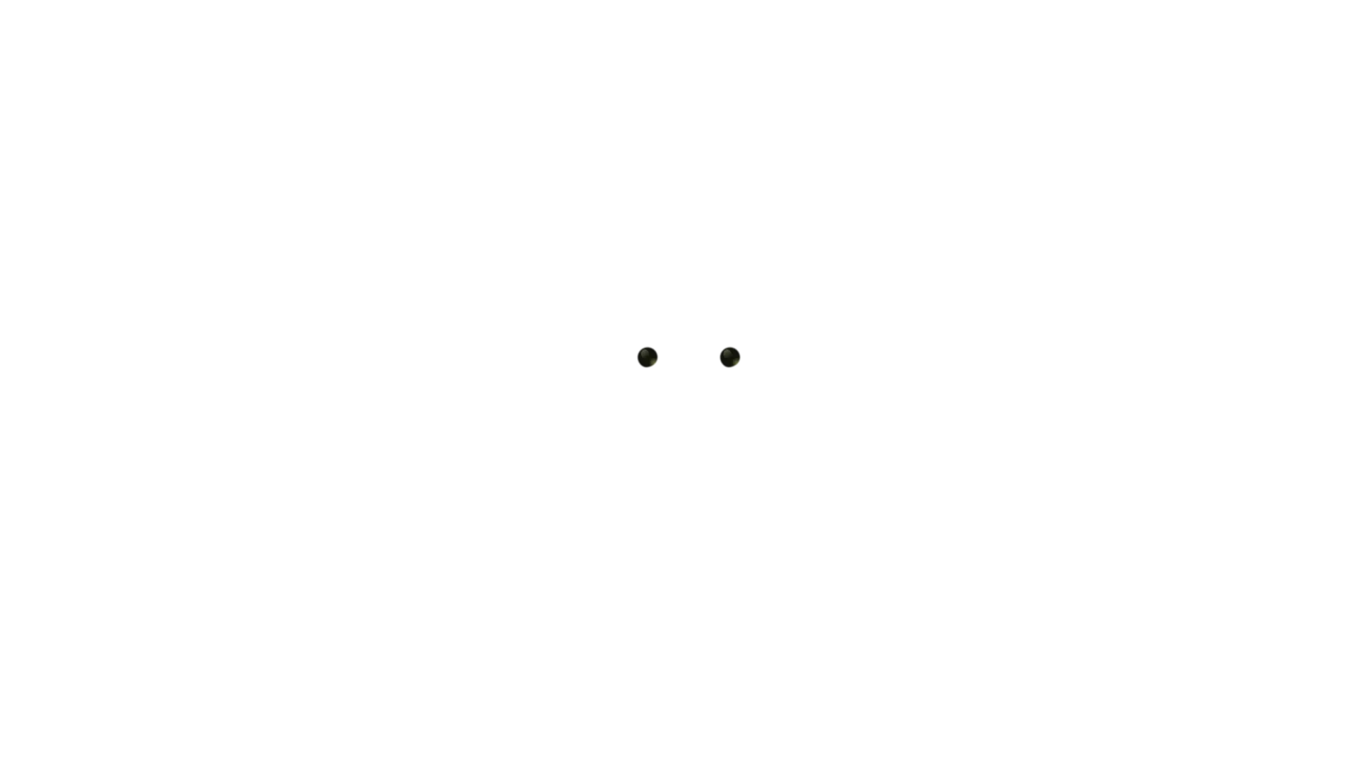 Close-up of two human eyes with green irises and dark pupil centers.