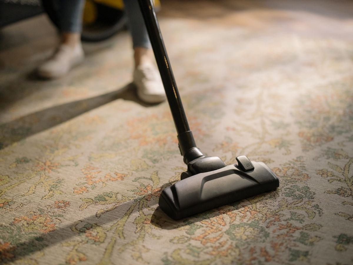 Carpet Cleaning — vacuuming a patterned rug