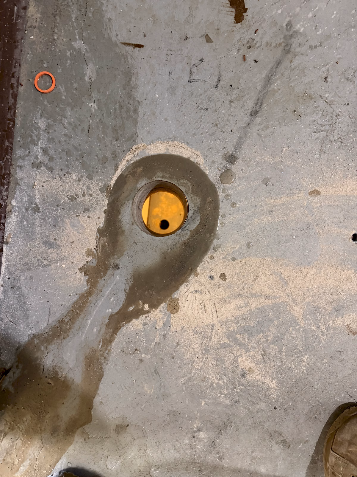 Completed concrete floor opening providing a vertical pathway between building levels.