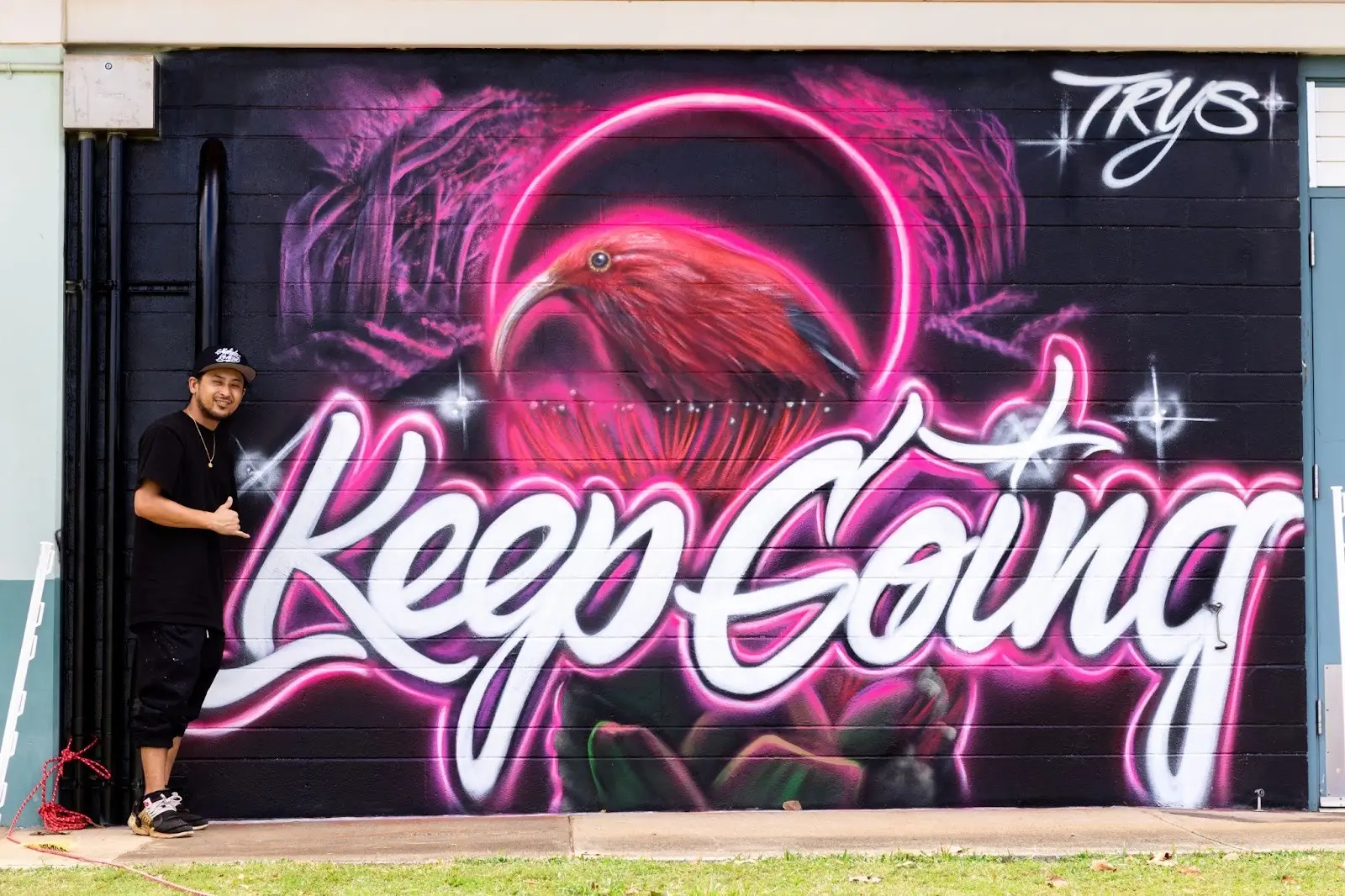 TRYS in front of the Keep Going mural at Kōloa Elementary