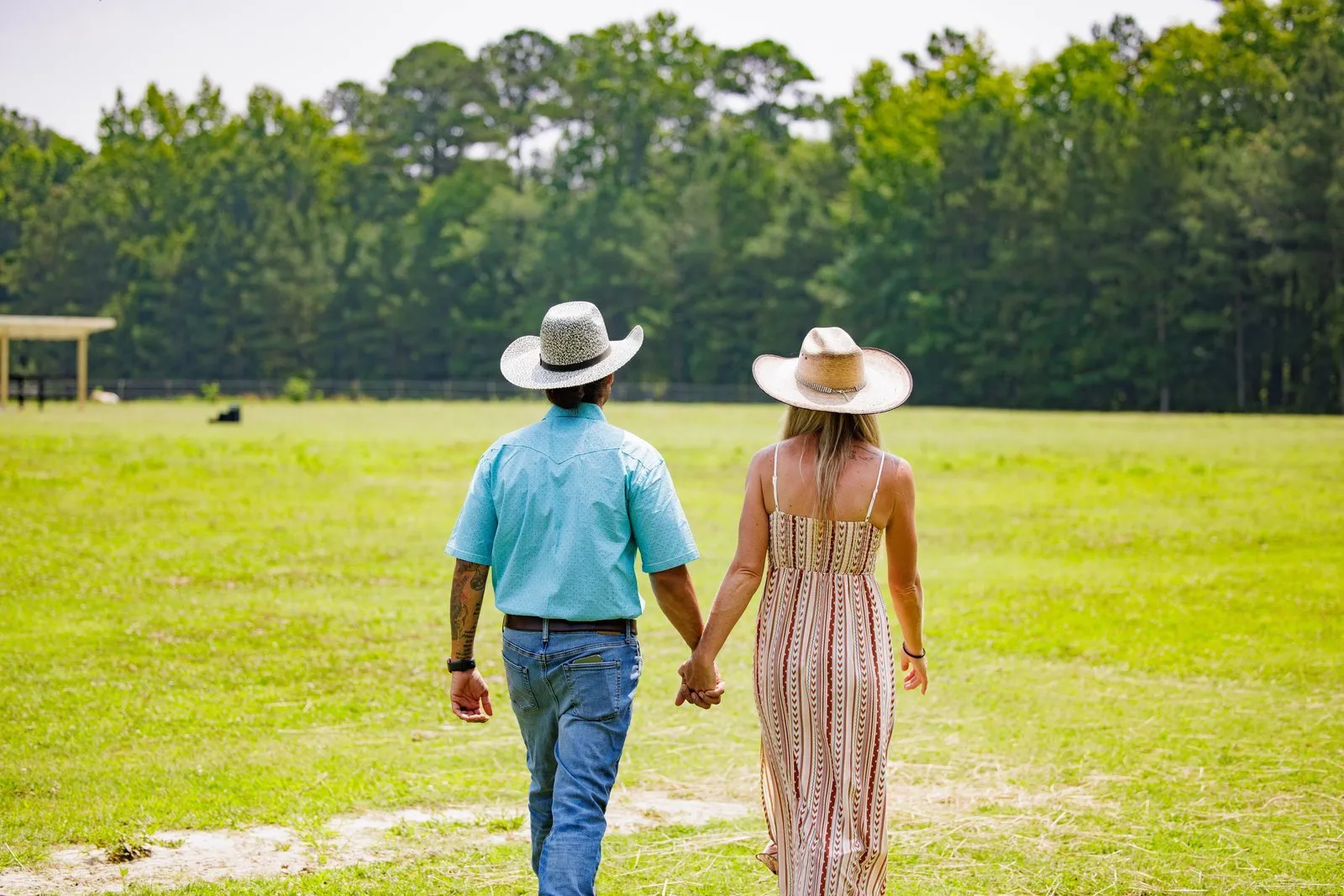 Couple walking through field