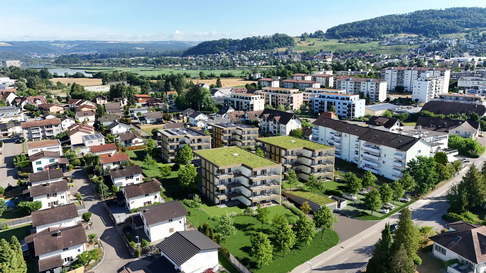 Luftaufnahme der geplanten Wohnüberbauung mit vier Mehrfamilienhäusern in Holzbauweise an der Böttsteinerstrasse in Böttstein.