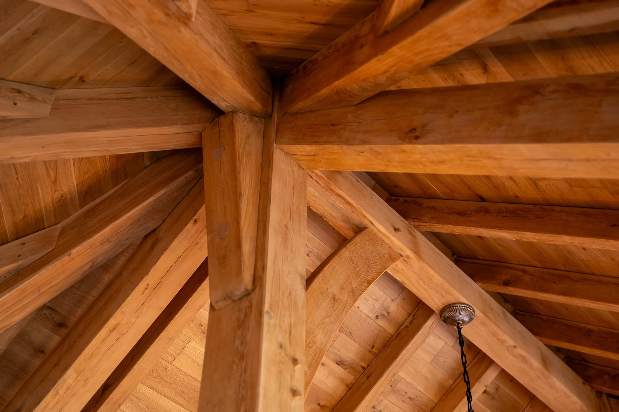 Looking up at the oak roof structure inside the pool house at Peterston-super-Ely